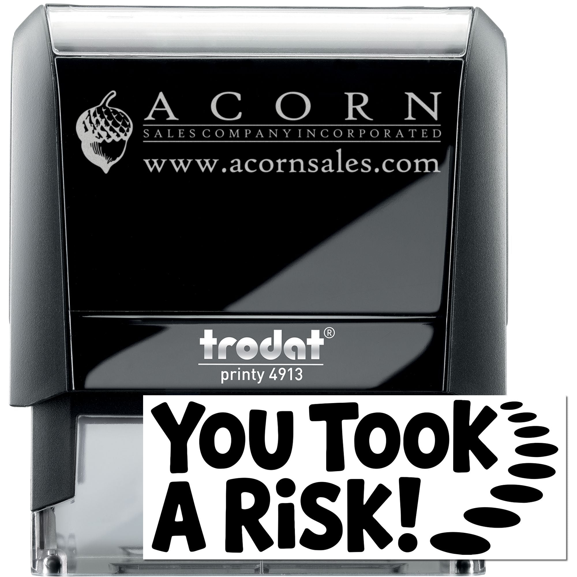 Custom self-inking rubber stamp with Acorn Sales logo, website, and You Took A Risk! imprint for business branding.