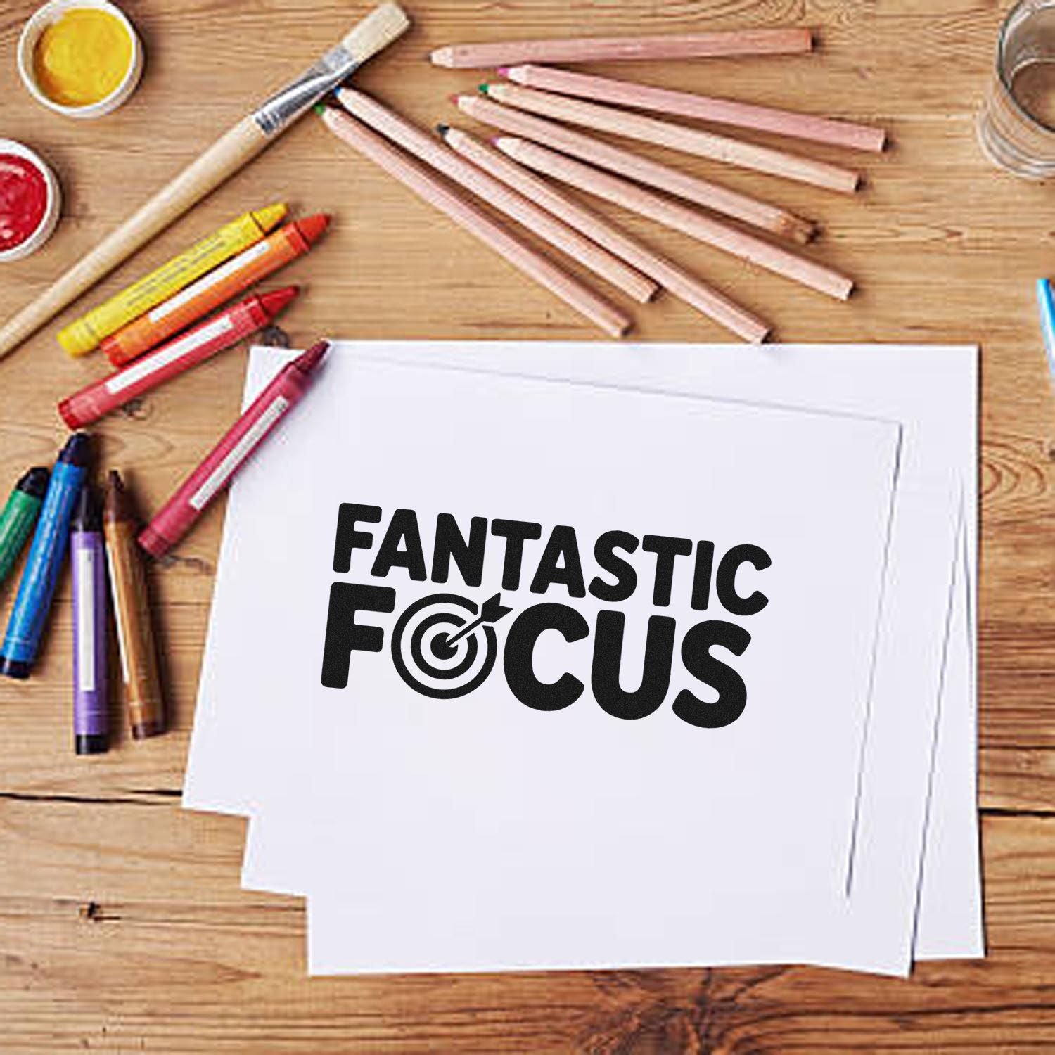 Fantastic Focus rubber stamp design on paper with art supplies, ideal for classroom, office, and motivational projects.
