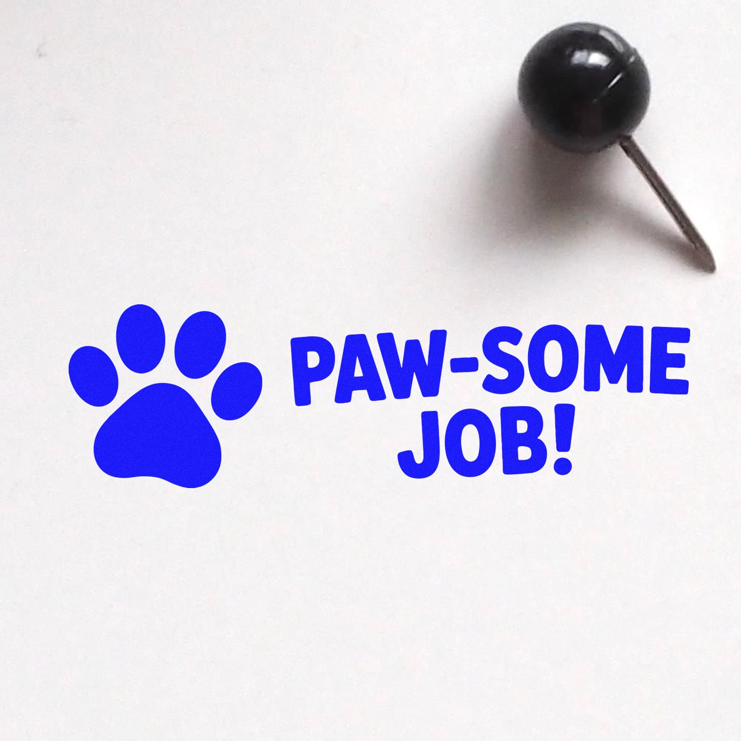 Blue paw print rubber stamp with Paw-some Job! text, perfect for pet-themed rewards, classroom praise, and custom stamping.