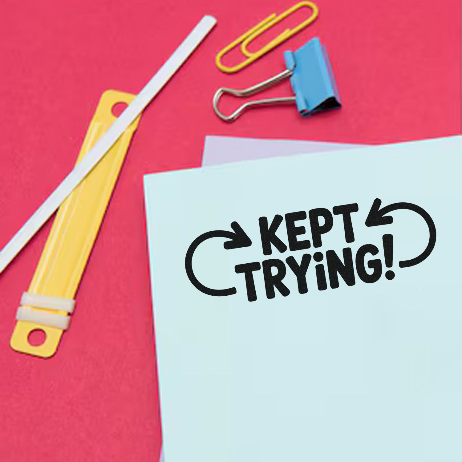 Motivational rubber stamp mockup reading Kept Trying! on stationery, ideal for office, classroom, or encouragement messaging.