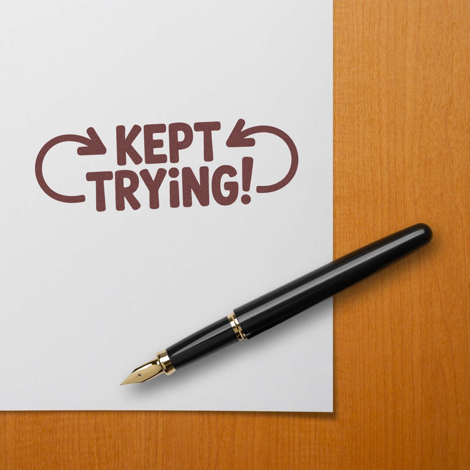 Kept Trying motivational rubber stamp imprint on paper with fountain pen, ideal for teacher reward and office use.