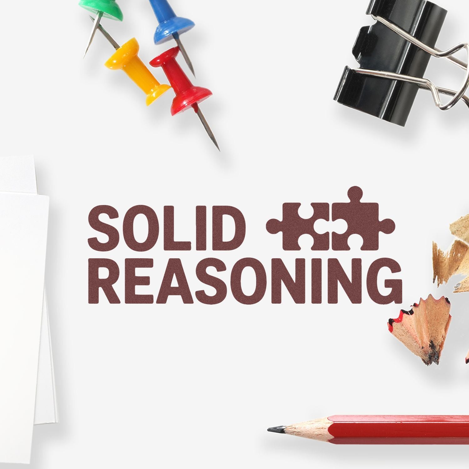 Solid Reasoning rubber stamp design with puzzle pieces, push pins and pencils for classroom, office or school use.