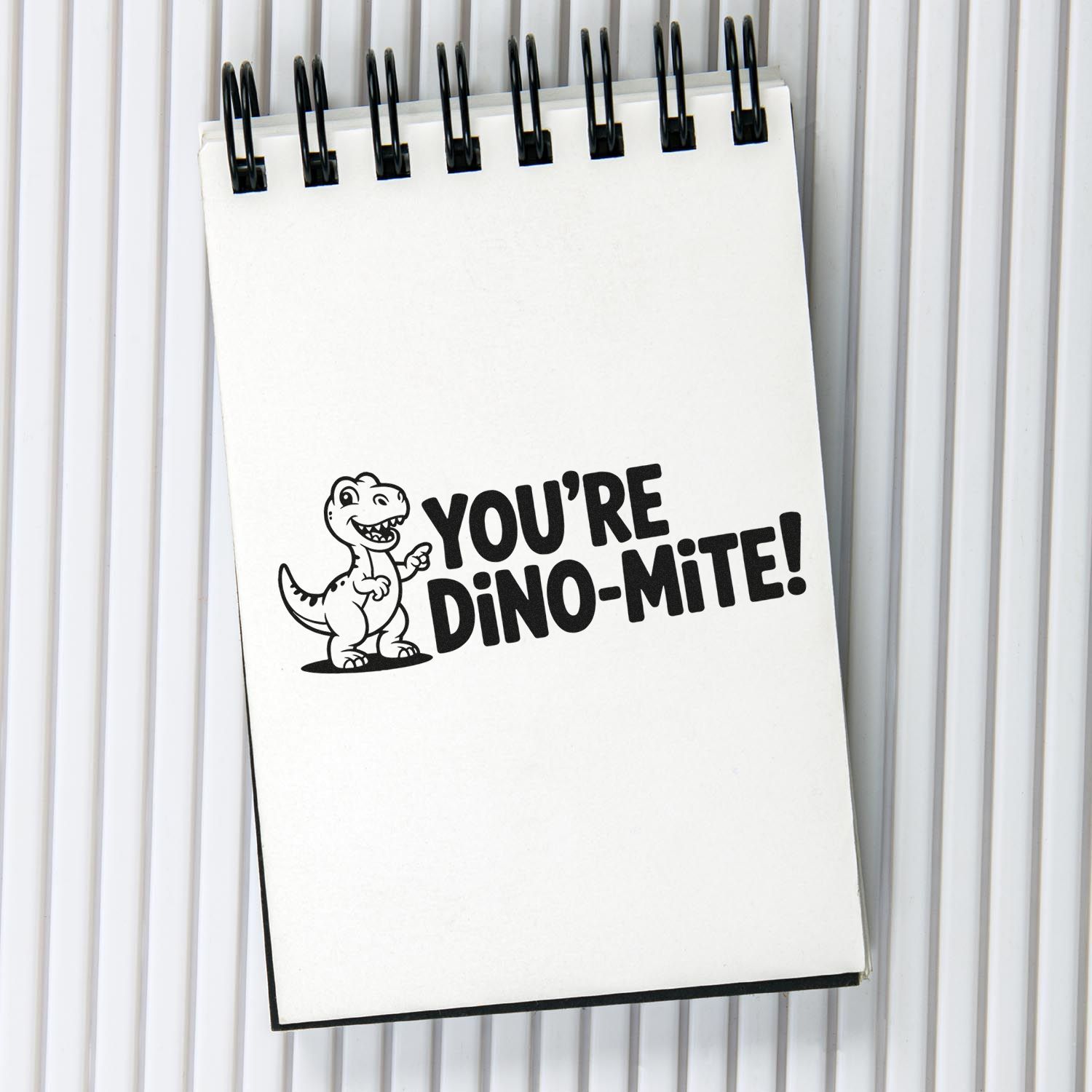 Funny dinosaur rubber stamp saying Youre Dino-mite! for kids cards, scrapbooking, and playful craft projects.