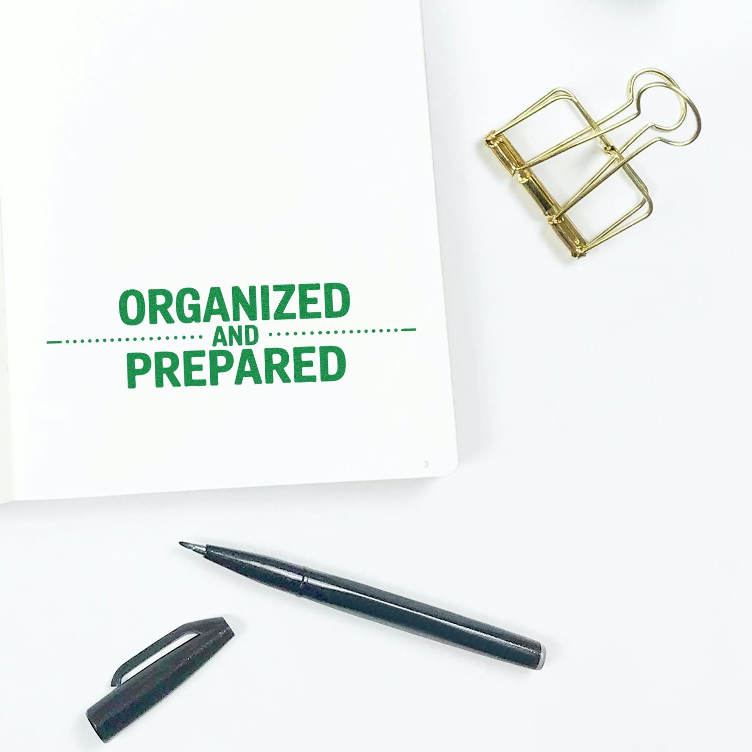 Organized and Prepared rubber stamp on notebook with pen and binder clip, ideal for planners, office organization, and journaling.