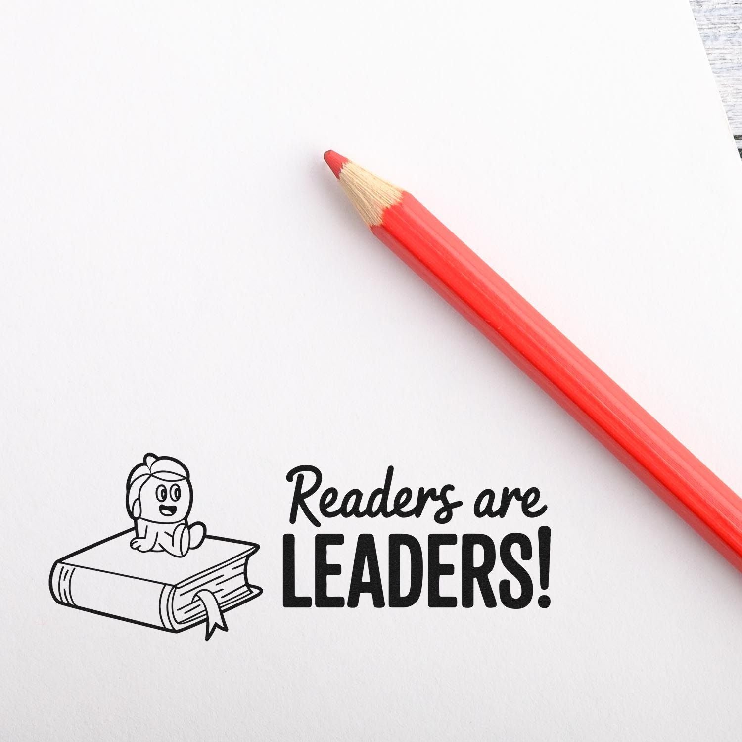 Readers Are Leaders rubber stamp design for teachers and libraries, featuring a child on a book and bold literacy quote.