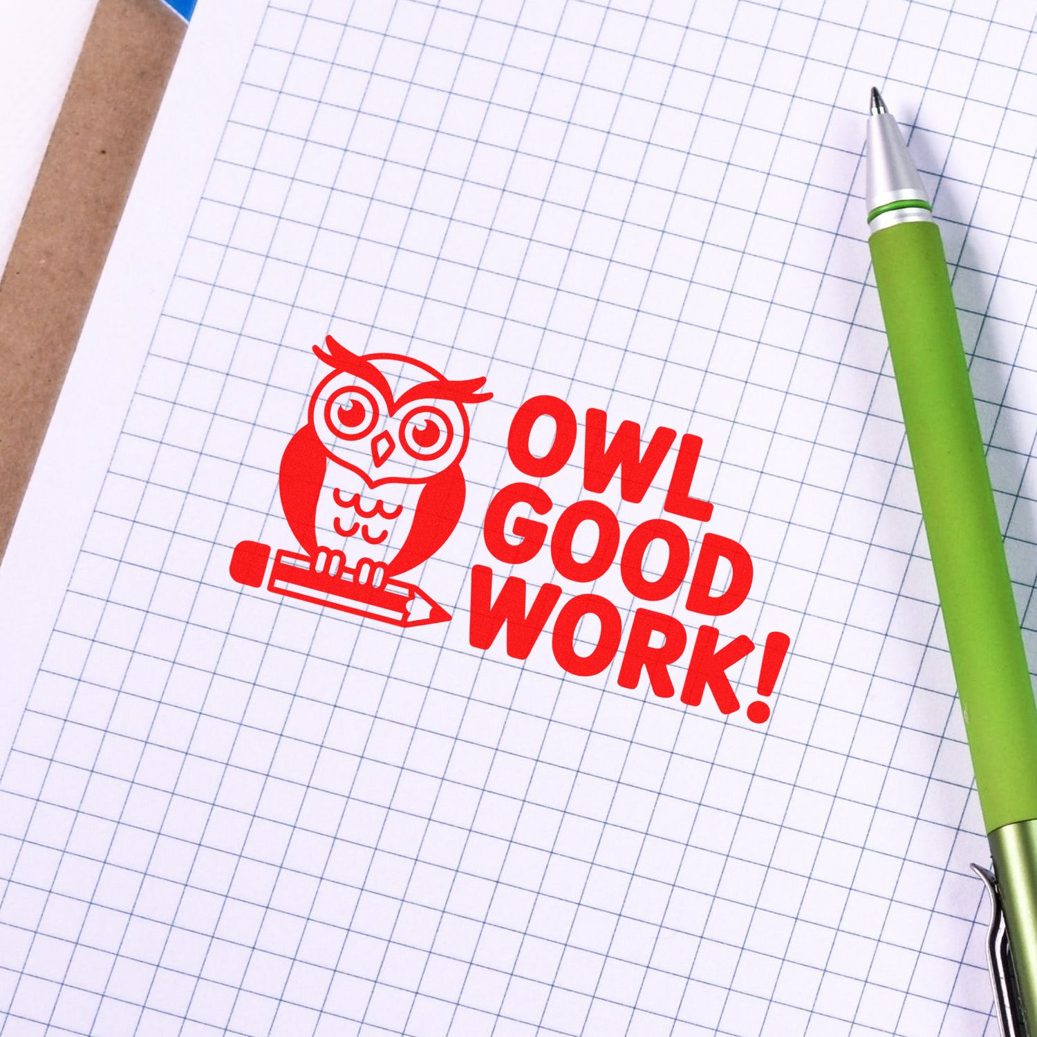Red owl OWL GOOD WORK! rubber stamp on graph paper, a motivational office stamp for teachers, planners, and rewards.