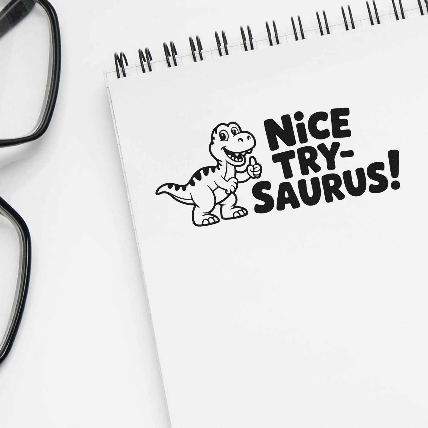 Funny Nice Try-saurus dinosaur rubber stamp imprint on notebook, ideal for teacher rewards and office use.