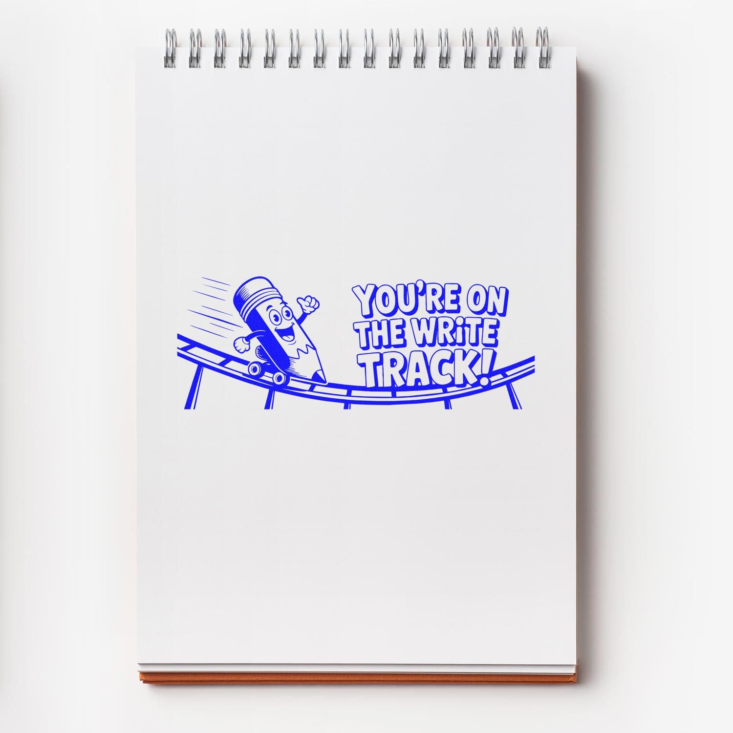 Blue rubber stamp saying Youre on the write track! for teacher encouragement, grading, and office feedback.
