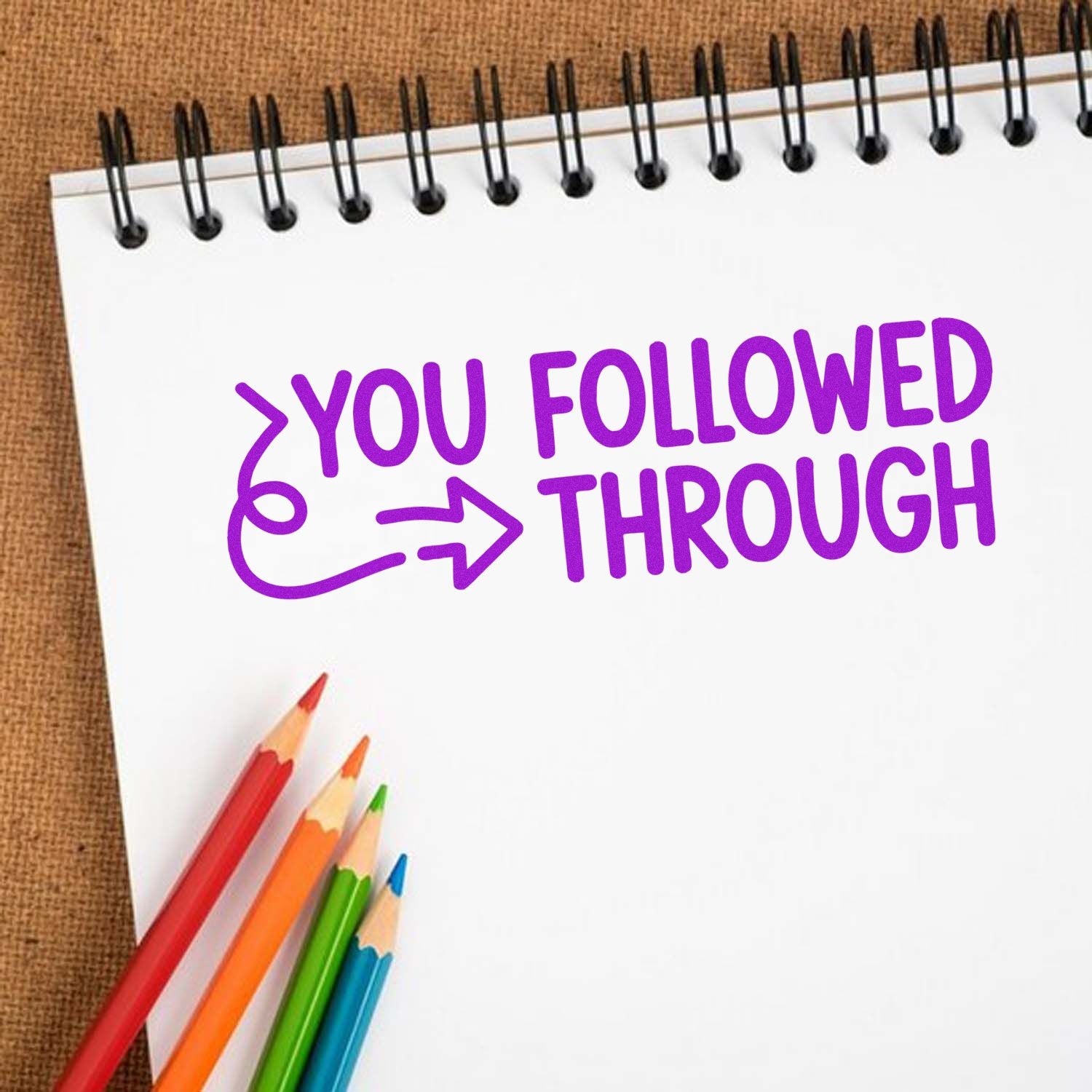 Purple You Followed Through motivational rubber stamp design on a notebook page with colored pencils.