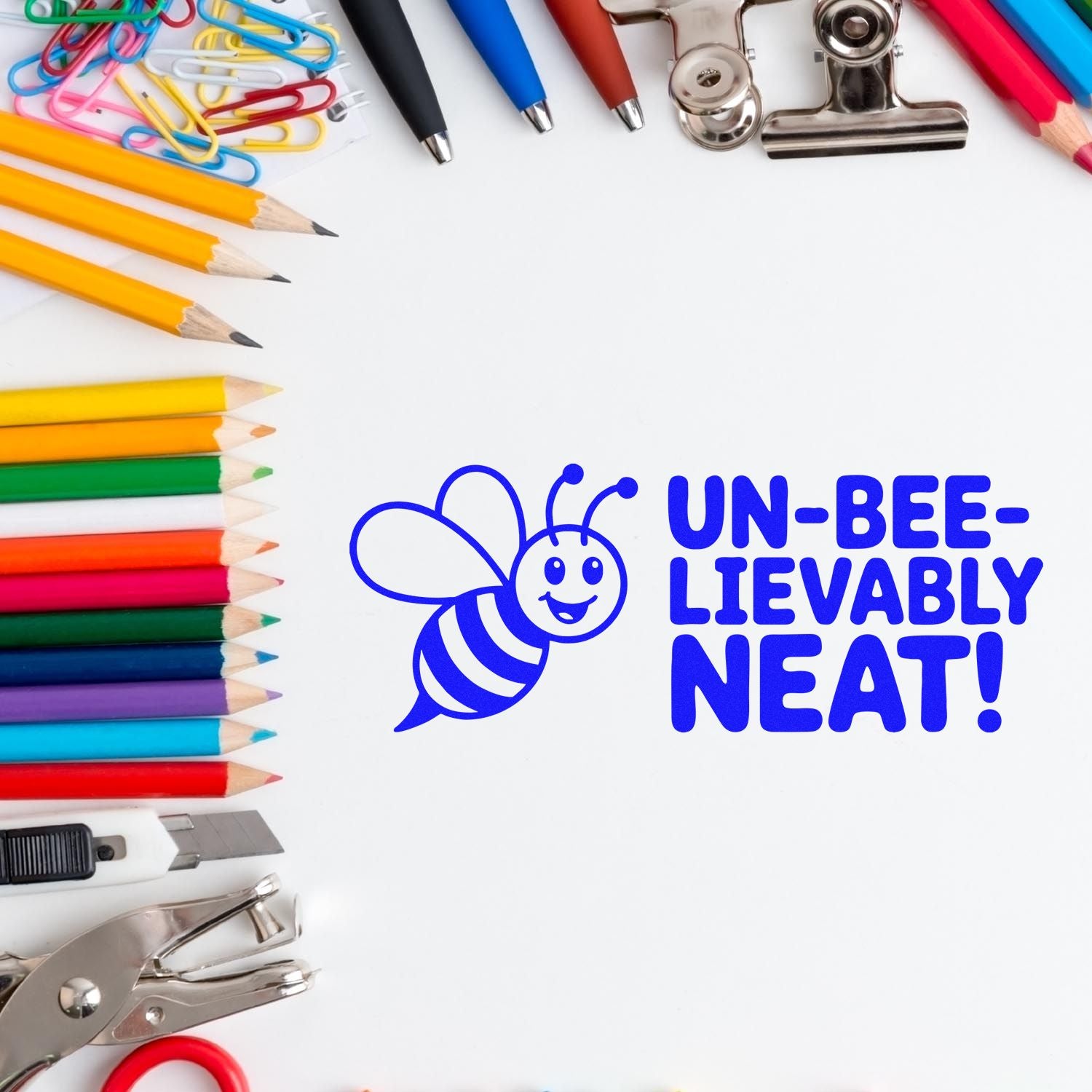 Bee rubber stamp saying Un-bee-lievably neat! framed by colorful pencils and school supplies.