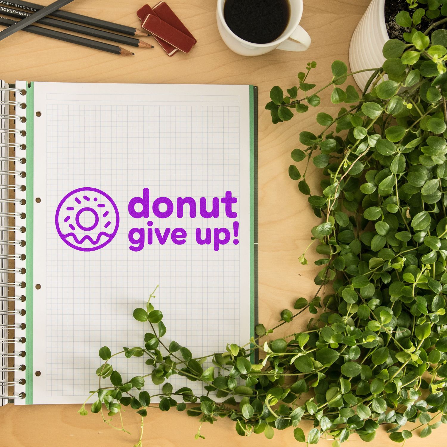 Purple donut give up rubber stamp on notebook, a fun motivational stamp for planners, teachers, and bakeries.