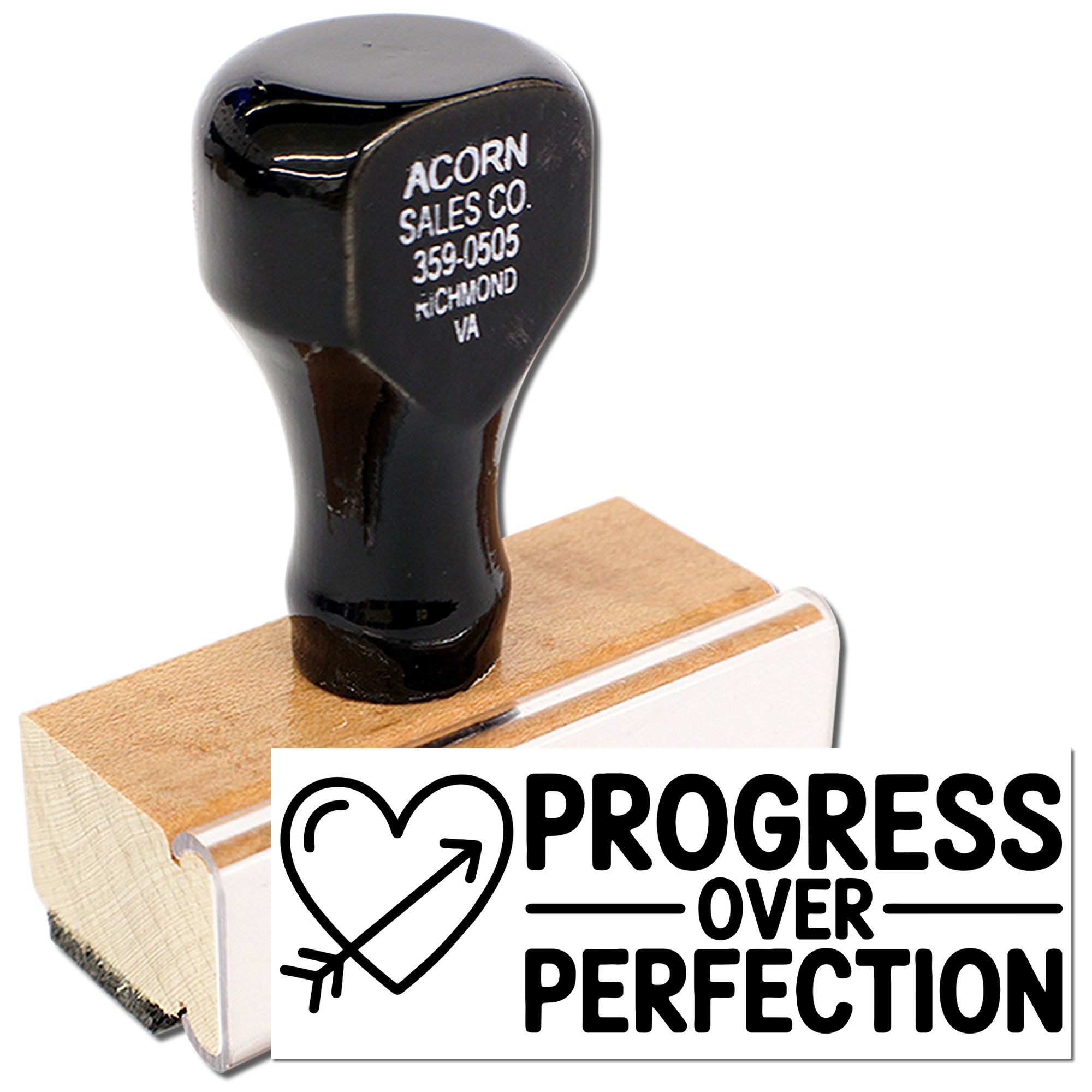 Custom wooden rubber stamp with heart arrow design and Progress Over Perfection message for motivational branding.