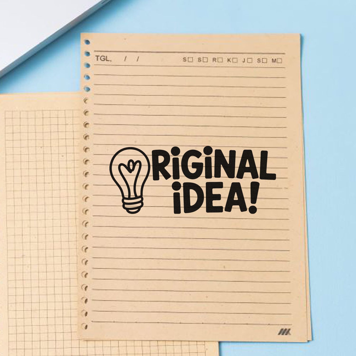 Original Idea! rubber stamp with lightbulb icon on notebook paper, ideal for creative stationery and craft projects
