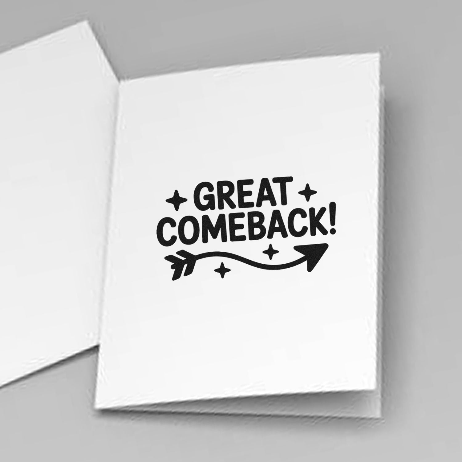 Great comeback rubber stamp with arrow and stars on folded white card for motivational stationery and packaging.