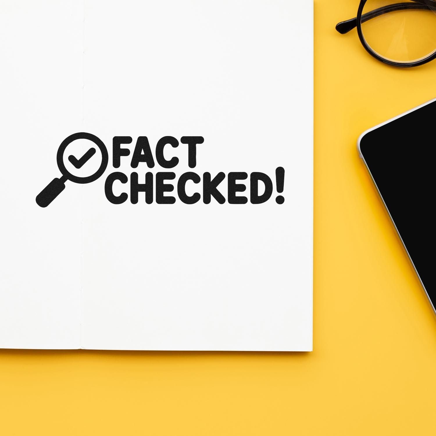 Fact checked rubber stamp design on paper with magnifying glass icon, ideal for verification and office branding.
