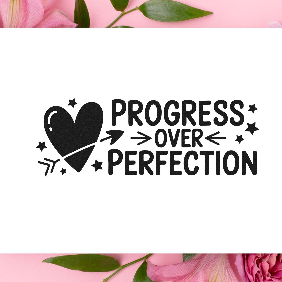 Motivational rubber stamp design with heart arrow and stars reading Progress Over Perfection.