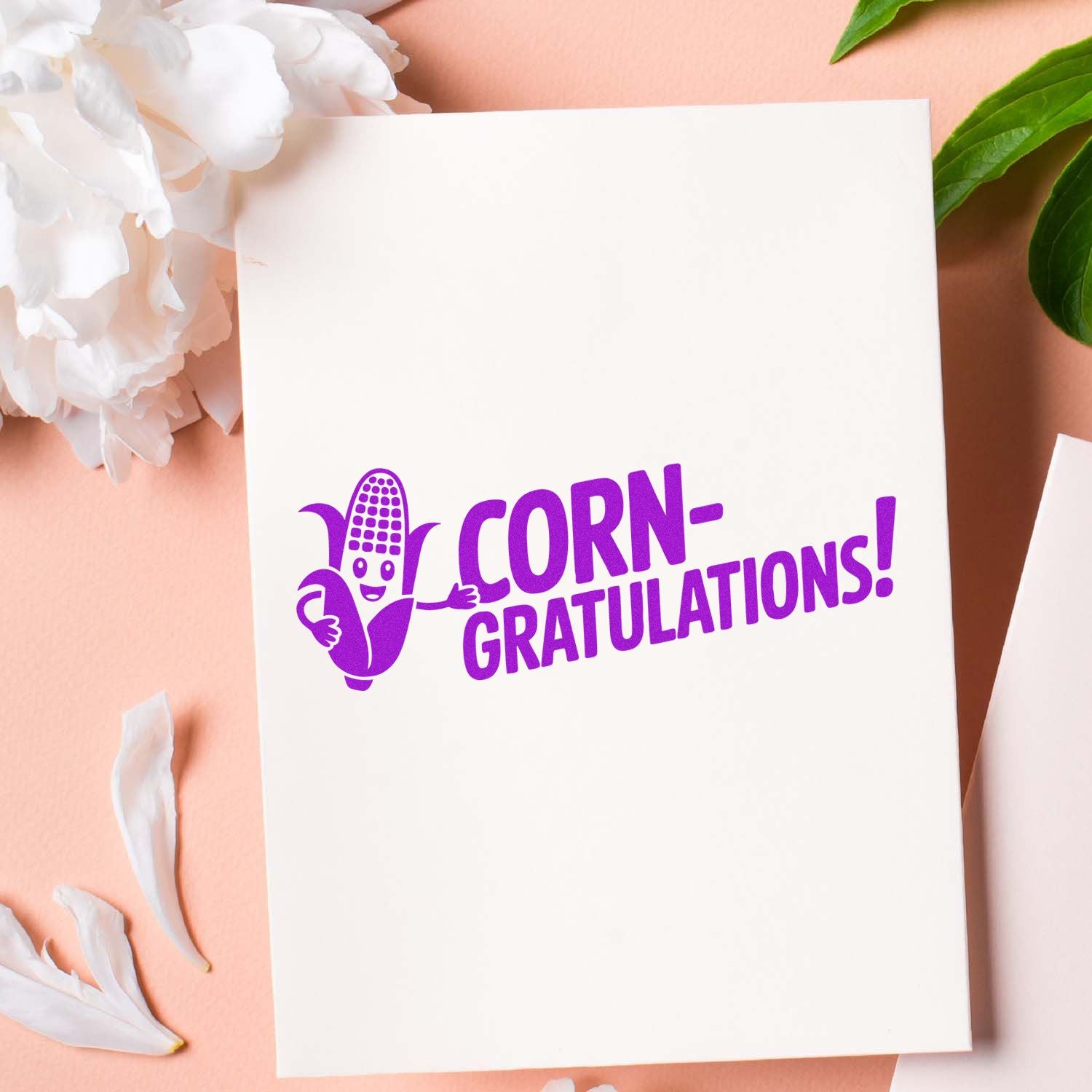 Corn-gratulations rubber stamp design with smiling corn illustration, perfect for funny congratulations cards and craft projects.