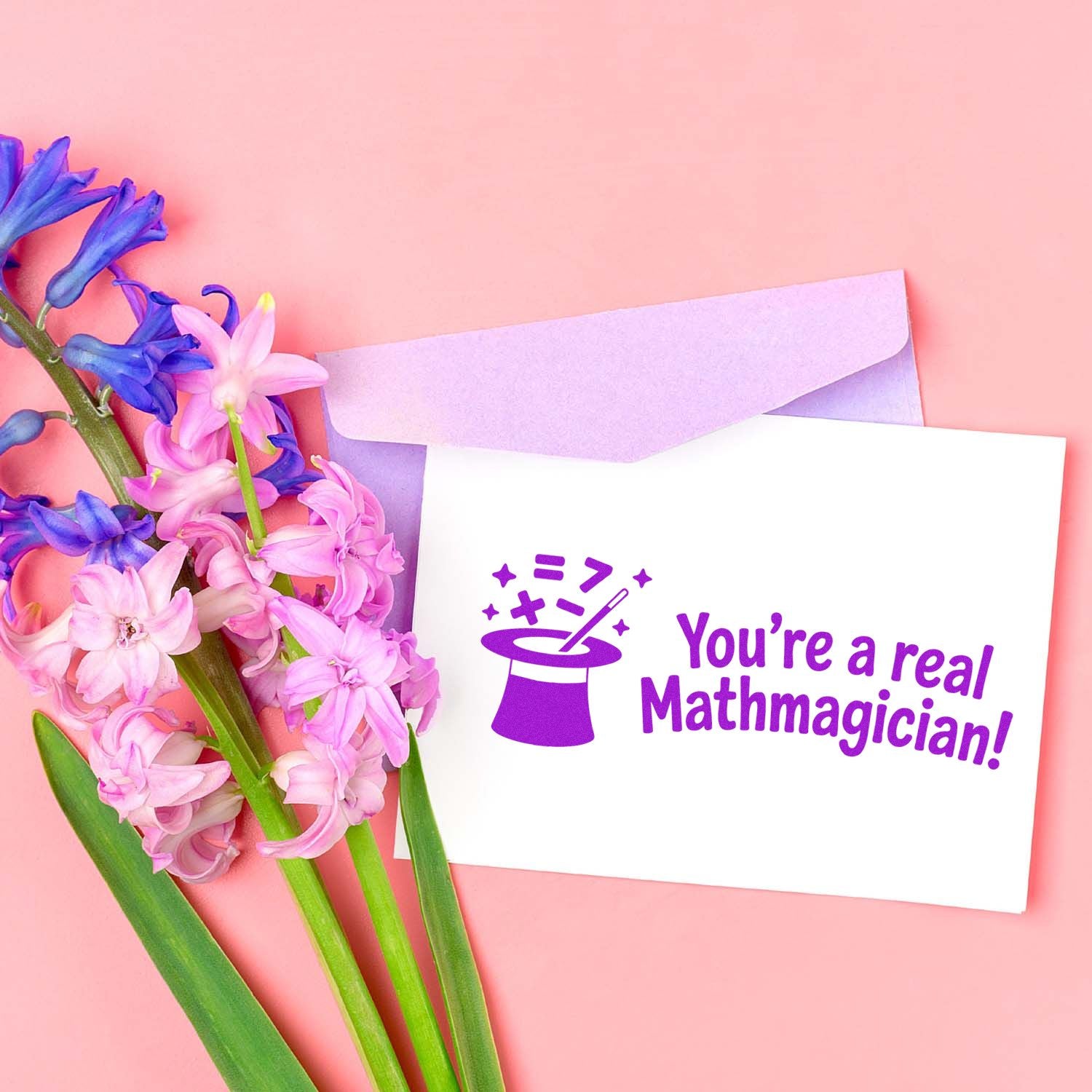 Youre a real Mathmagician rubber stamp design for math teacher cards, featuring a magic hat icon and bold purple lettering.