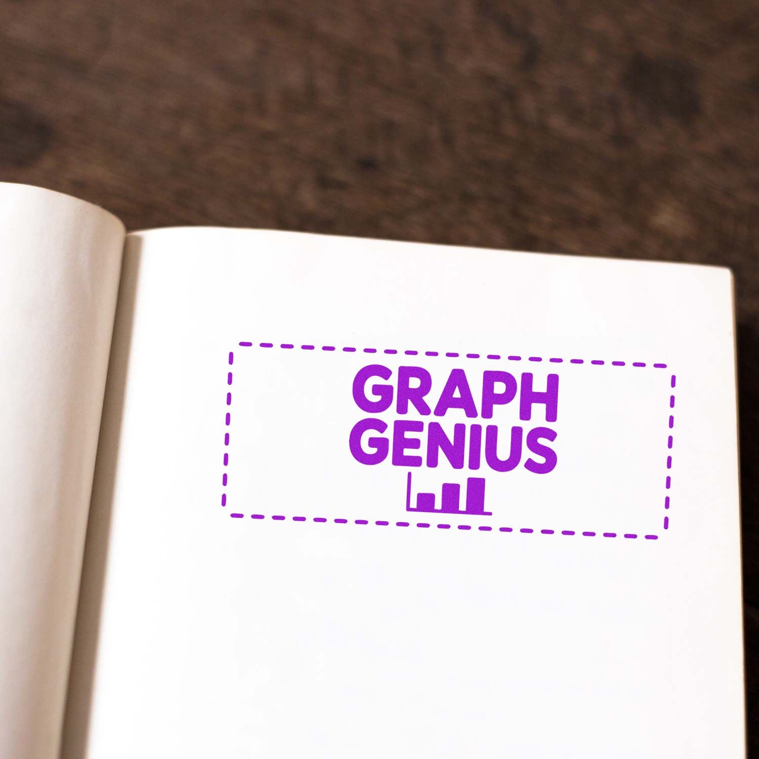 Custom Graph Genius rubber stamp on notebook page, ideal for teachers, analysts, and creative office branding.