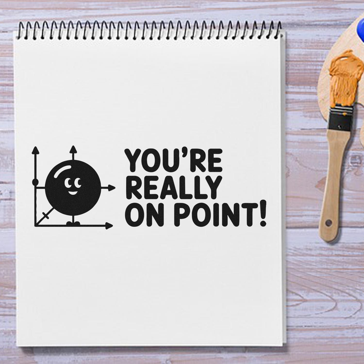 Rubber stamp design with Youre Really On Point! message and cute target graphic on a notebook page.
