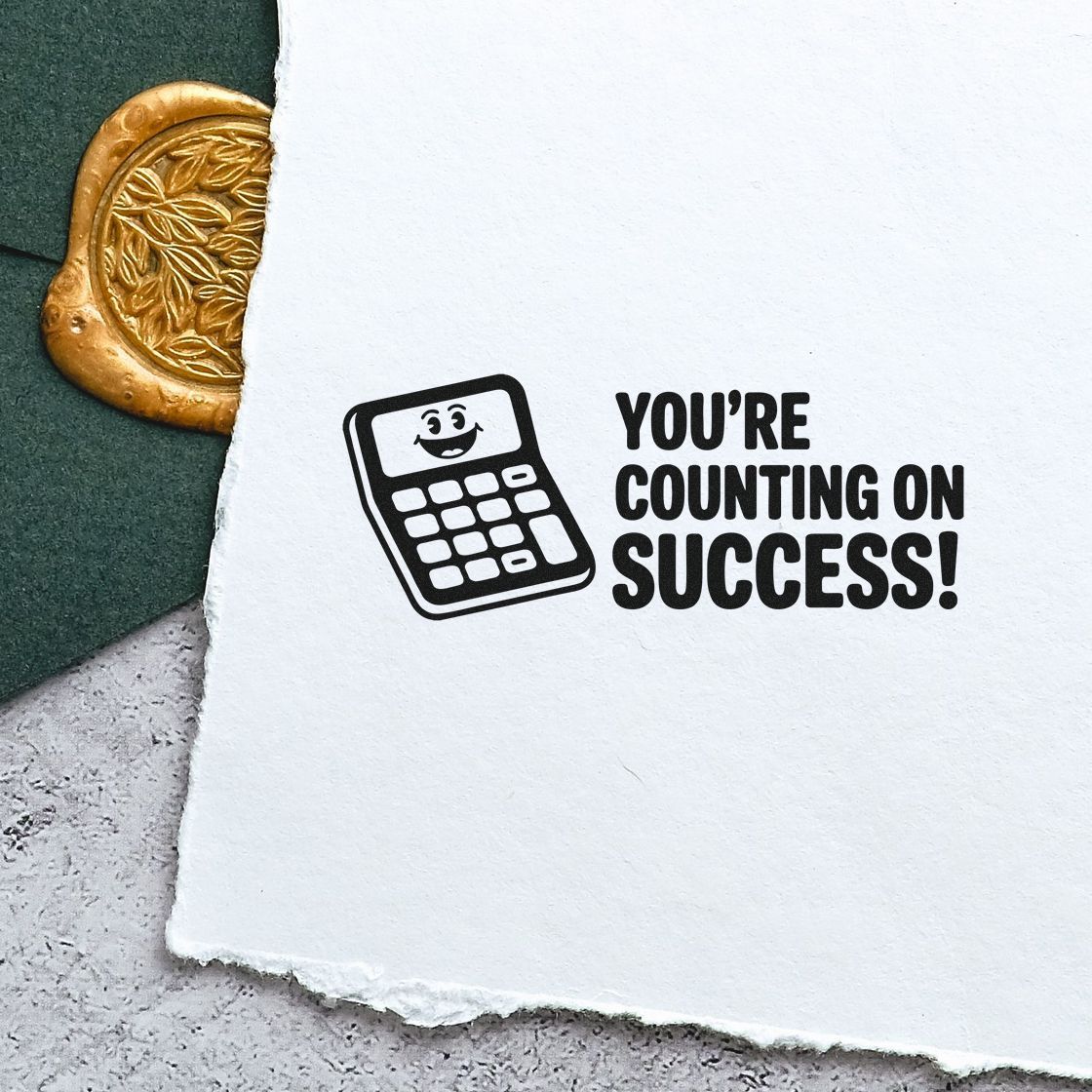 Success-themed rubber stamp impression with smiling calculator and Youre Counting on Success! for office paperwork.