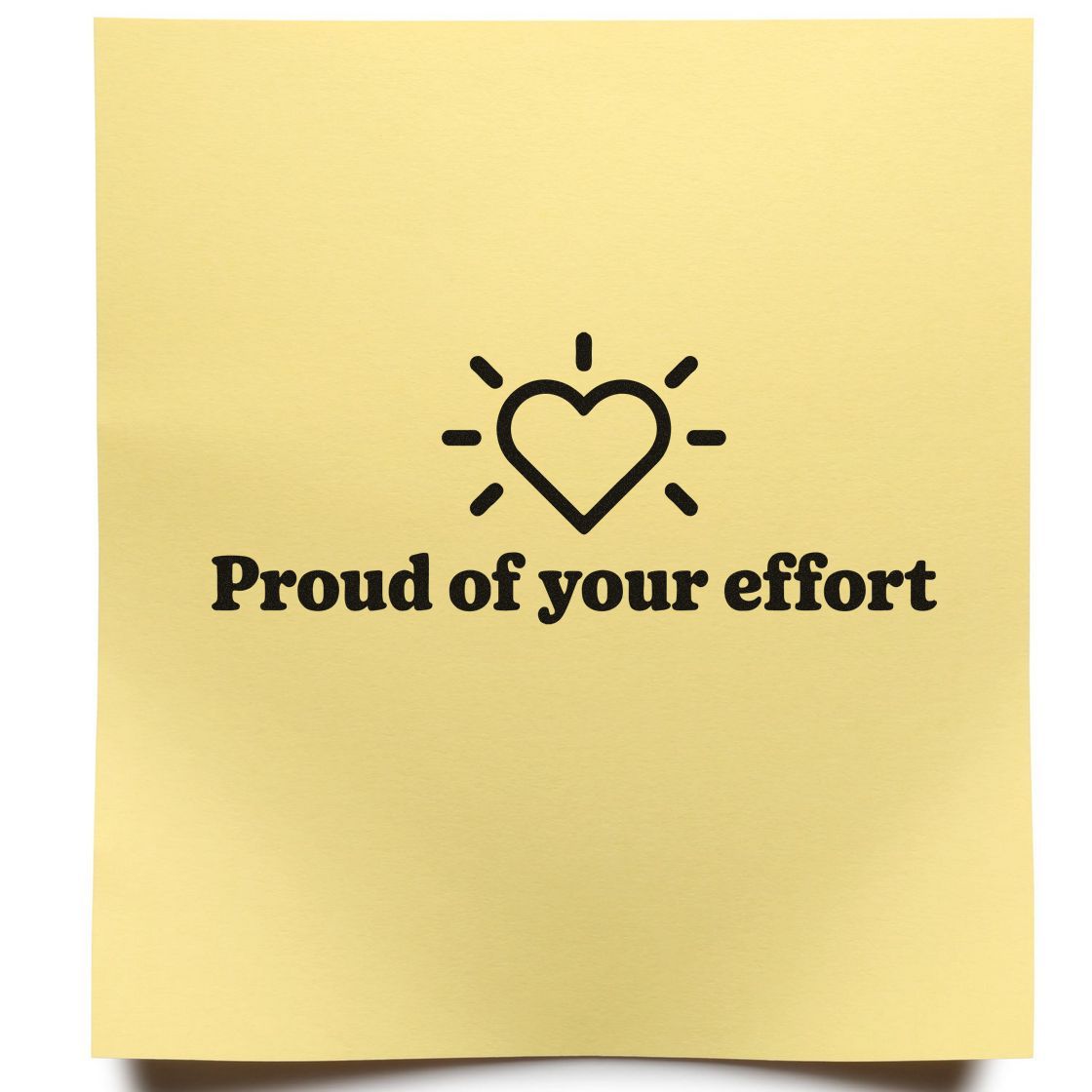 Encouragement rubber stamp with heart icon and Proud of your effort message on yellow paper.
