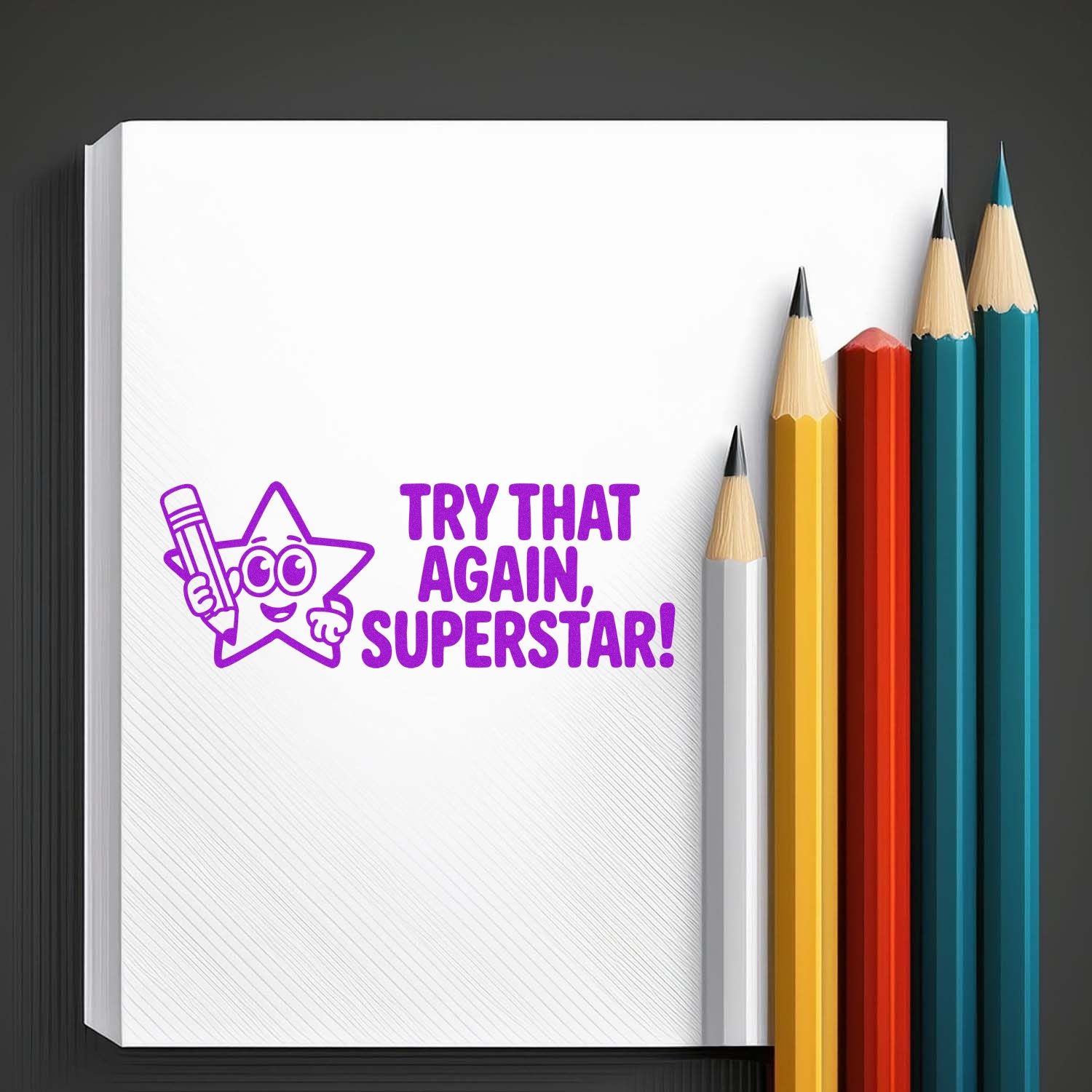Motivational rubber stamp reading Try That Again, Superstar! with star pencil graphic for classroom feedback and teacher use.