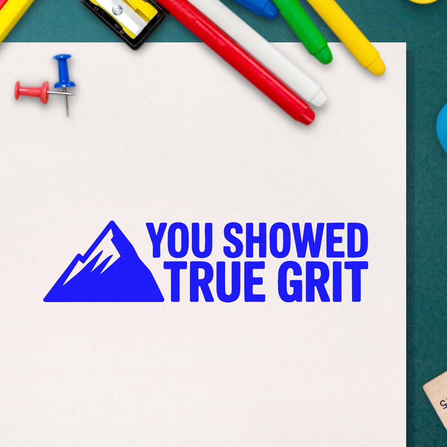Rubber stamp design with mountain icon and You showed true grit text for classroom reward or encouragement.