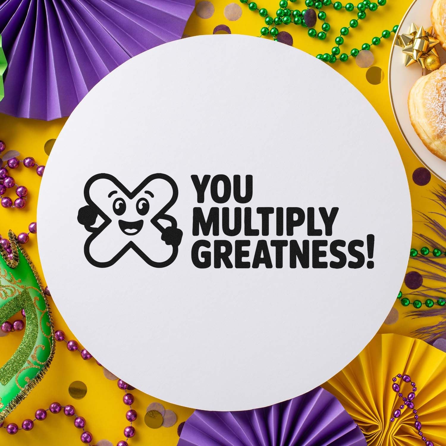 Custom rubber stamp with smiling mascot and You Multiply Greatness! text for Mardi Gras crafts, favors, and party branding.