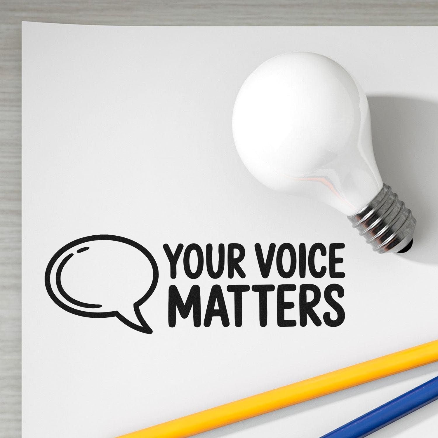 Custom rubber stamp design with speech bubble and light bulb, featuring Your Voice Matters for advocacy or classroom use.