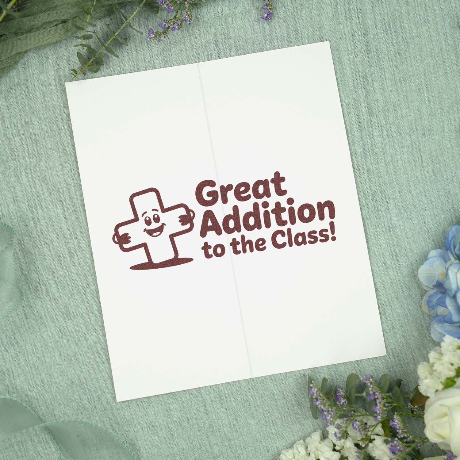 Rubber stamp design reading Great Addition to the Class! with a smiling plus sign for teacher and classroom rewards.