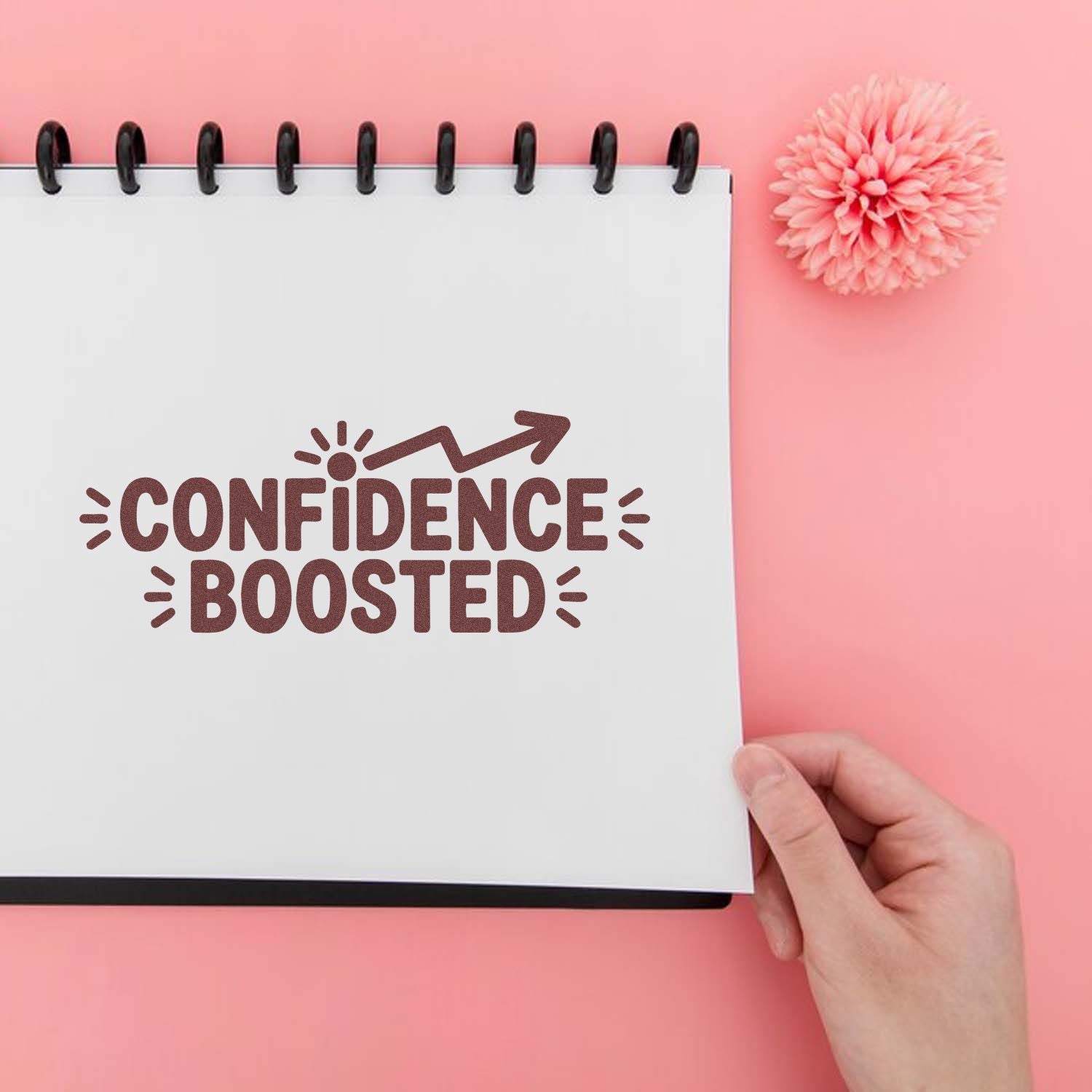 Confidence Boosted rubber stamp design on notebook, ideal for motivational planner stamps and craft projects.
