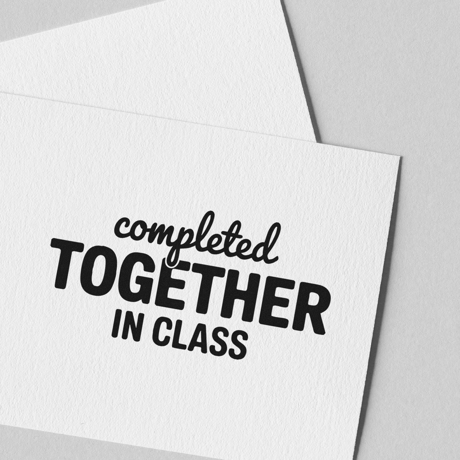 Completed Together in Class rubber stamp on white paper, ideal for teacher feedback and classroom projects.