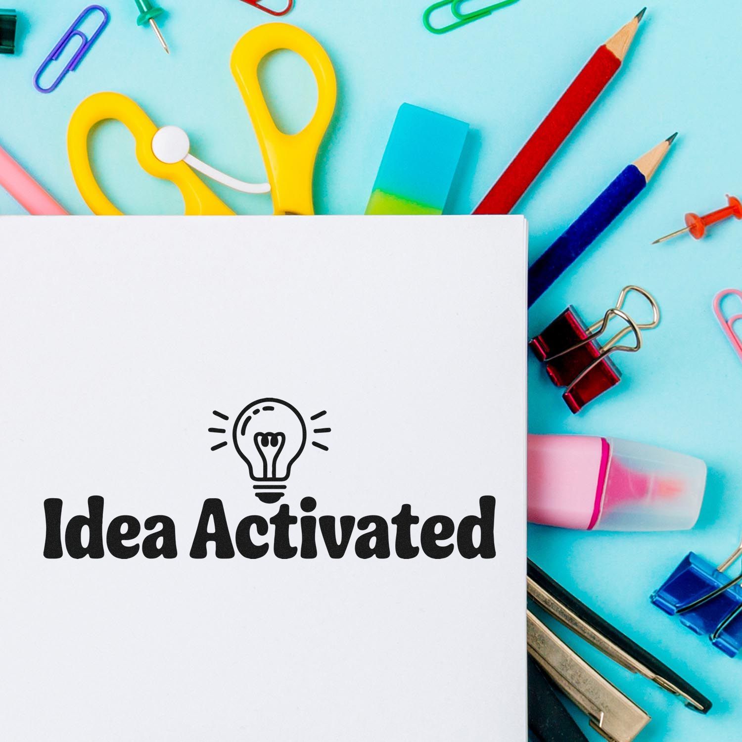 Idea Activated rubber stamp design with lightbulb icon for creative office projects, planners, and stationery.