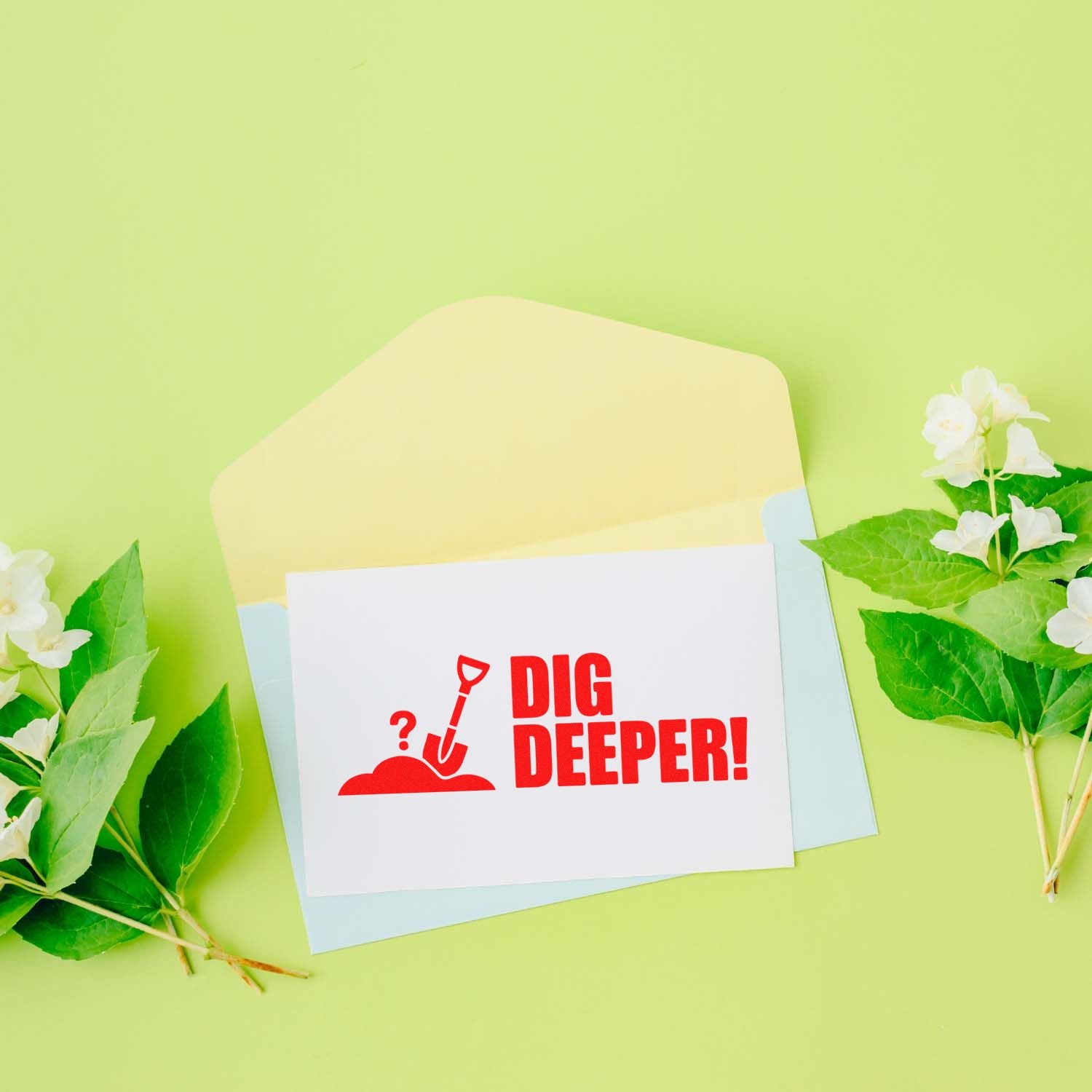 Dig Deeper! custom rubber stamp design with shovel icon on stationery, surrounded by floral accents and envelopes.
