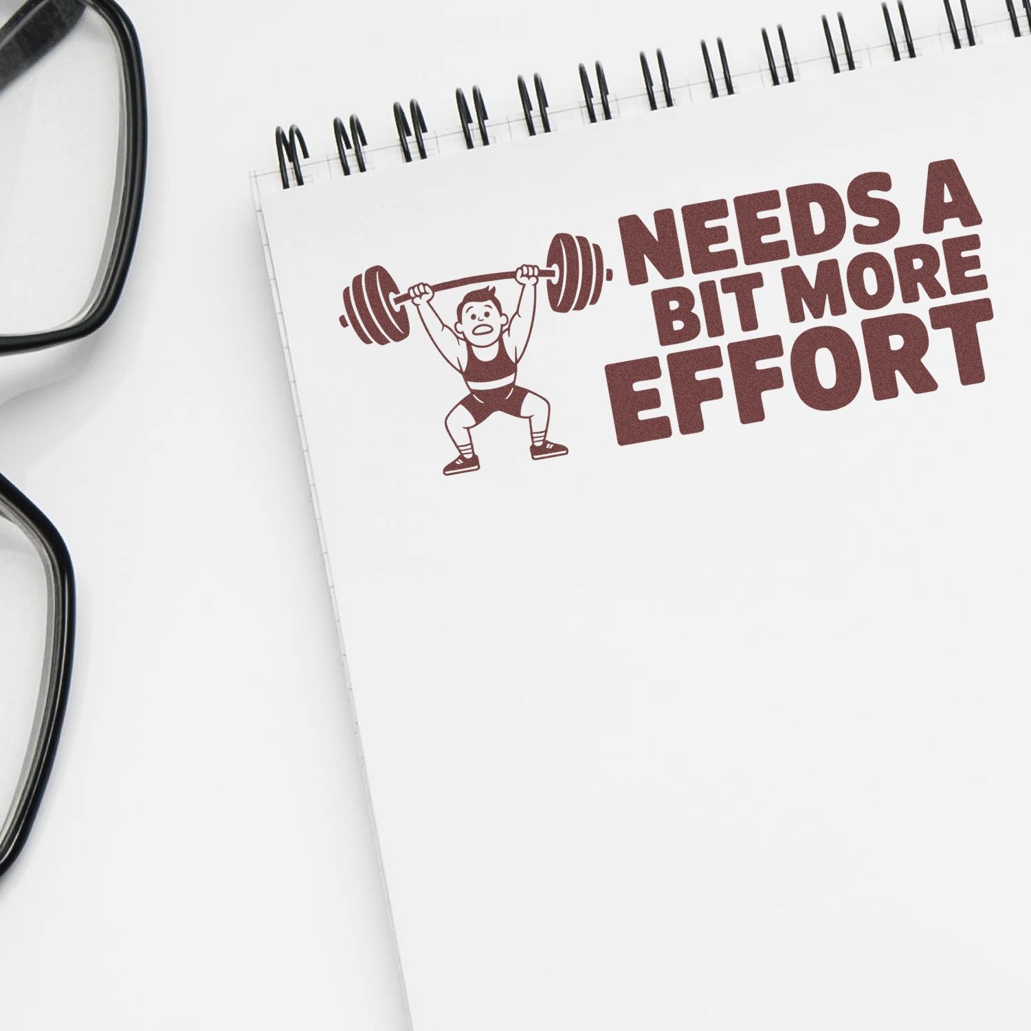 Rubber stamp design with weightlifter and Needs a Bit More Effort text for fitness motivation and coaching feedback.