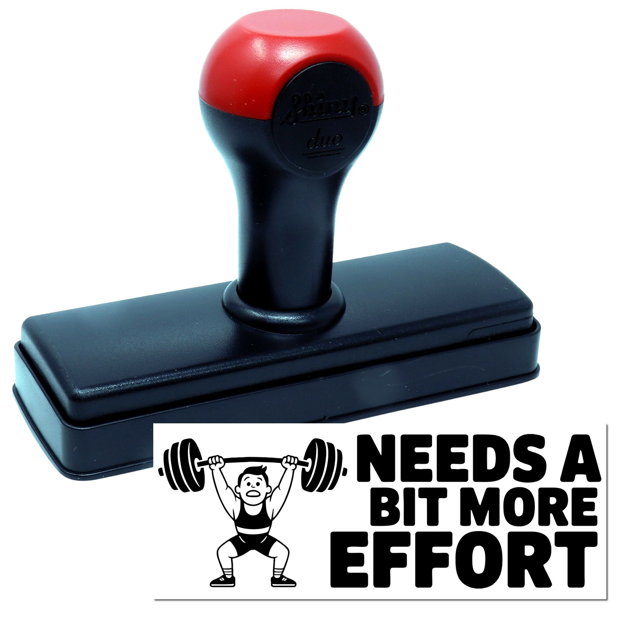 Self-inking rubber stamp with Needs a Bit More Effort weightlifter design for humorous office feedback.