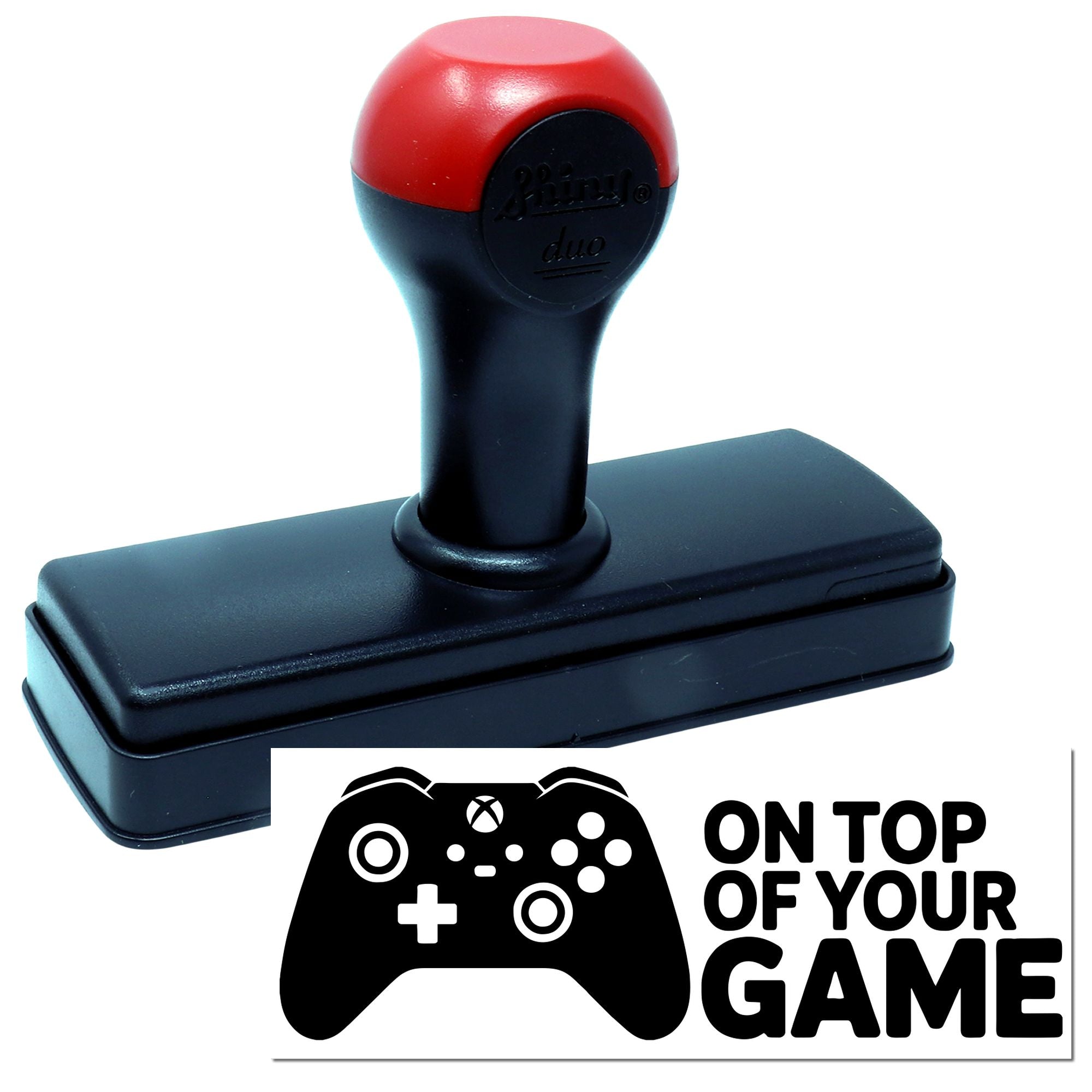 Custom self-inking rubber stamp with gaming controller logo and On Top of Your Game text for gamer branding.