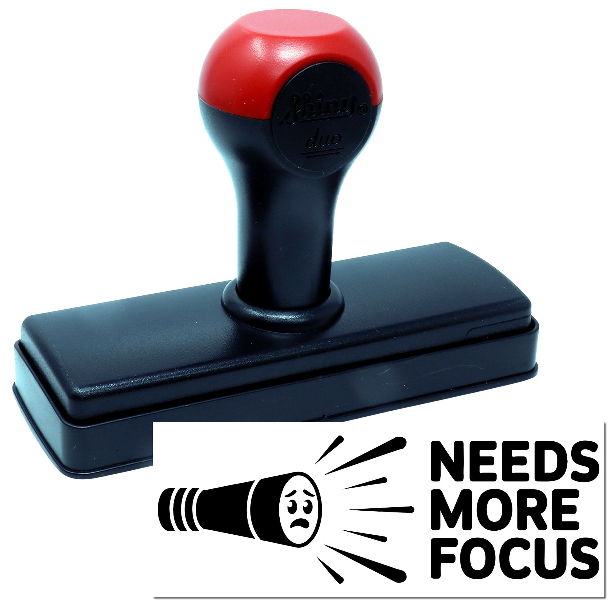 Self-inking rubber stamp with Needs More Focus imprint, perfect for office feedback, classroom grading, and custom stamps.