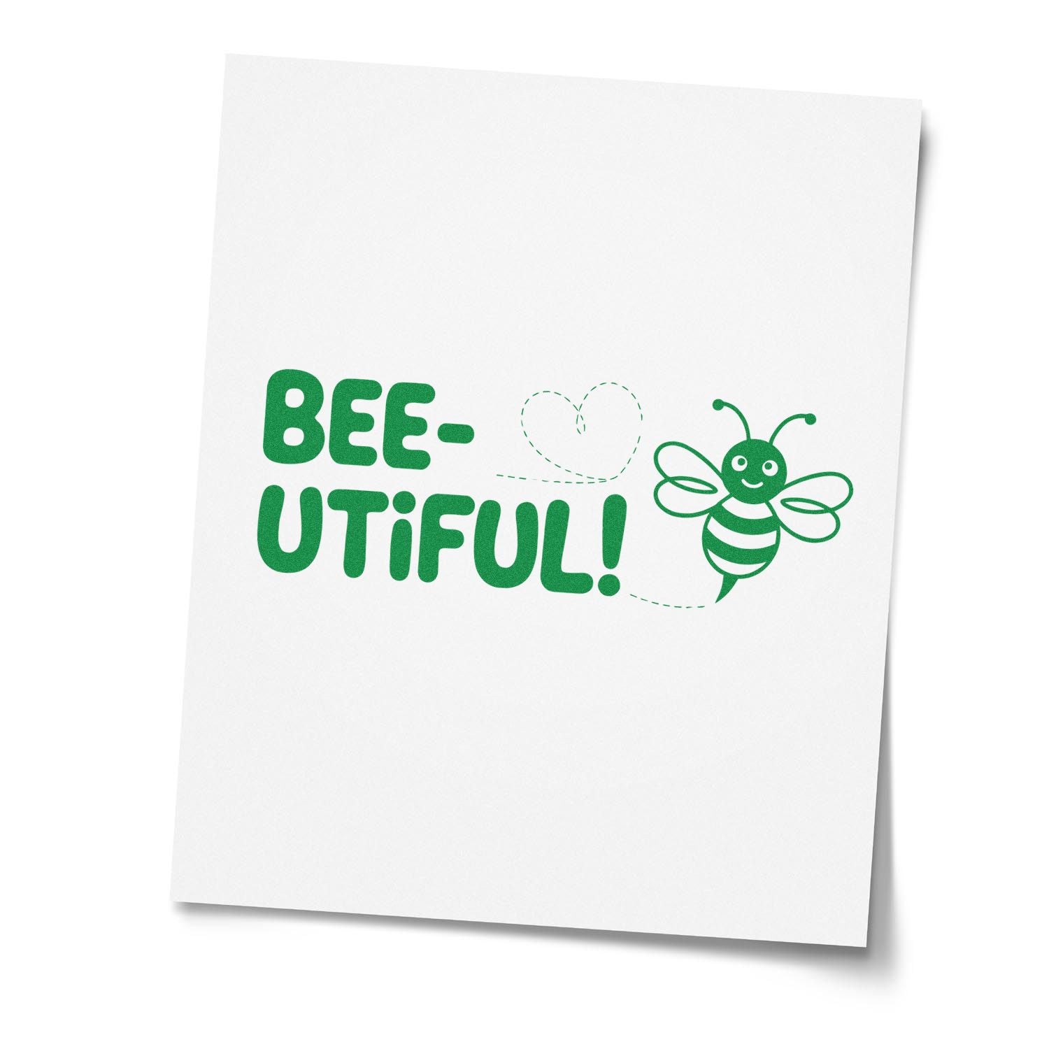 Bee-utiful bee-themed rubber stamp design with smiling bee and heart trail in green.