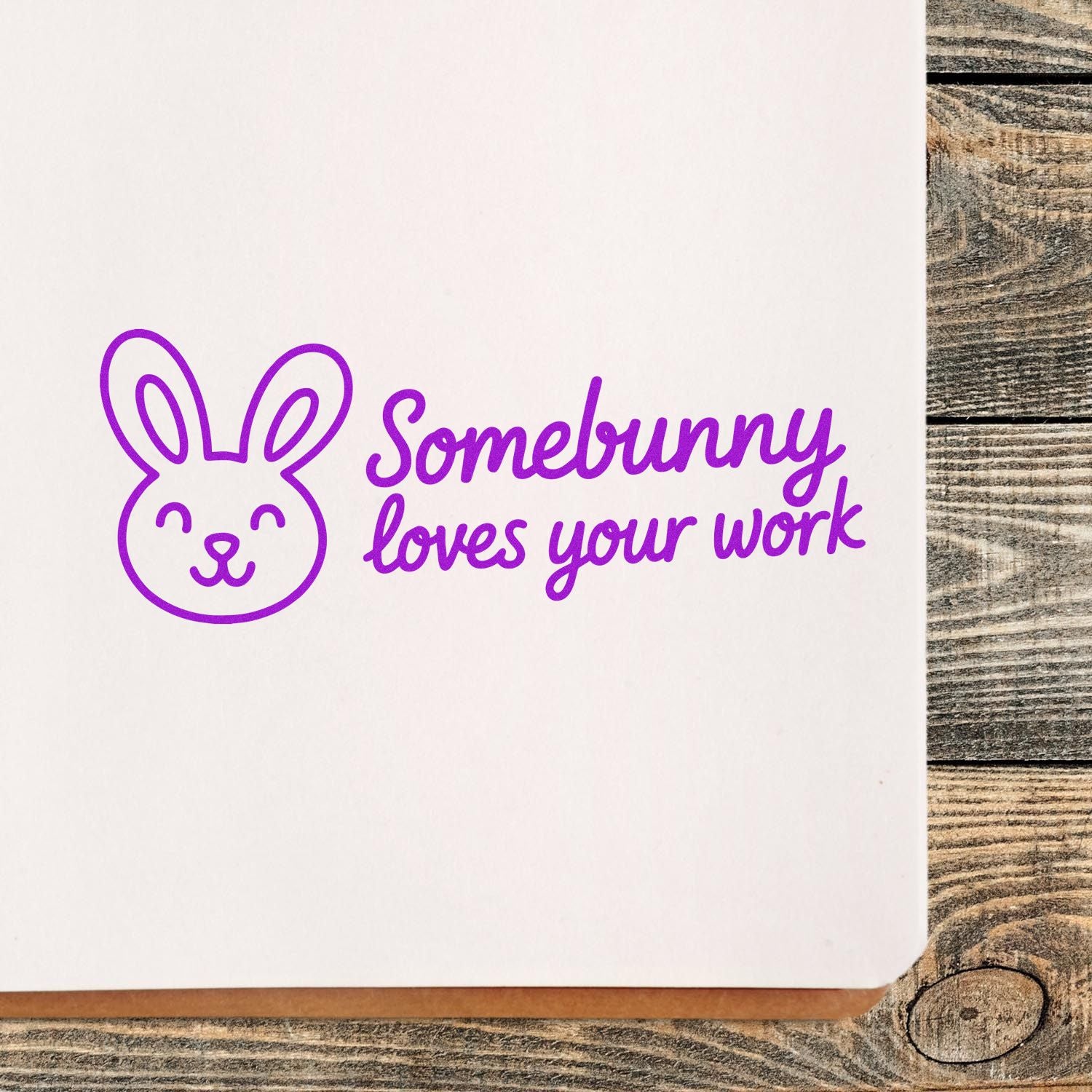 Purple bunny rubber stamp reading Somebunny loves your work on paper, a cute motivational craft stamp design.