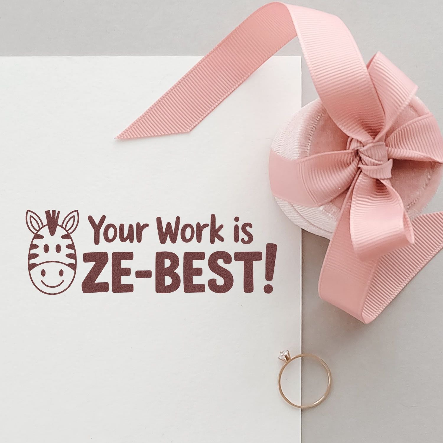 Zebra-themed rubber stamp reading Your Work is ZEBEST! on a gift card with pink ribbon bow.
