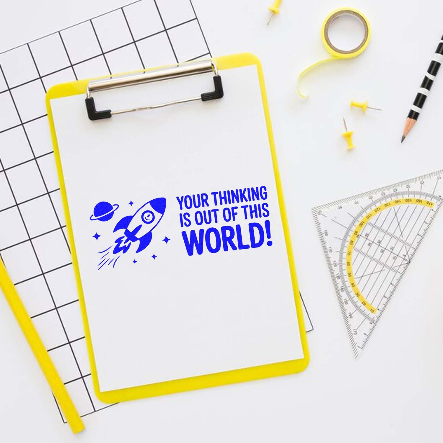 Custom rubber stamp with rocket and Your Thinking Is Out of This World! for teacher feedback and student praise.