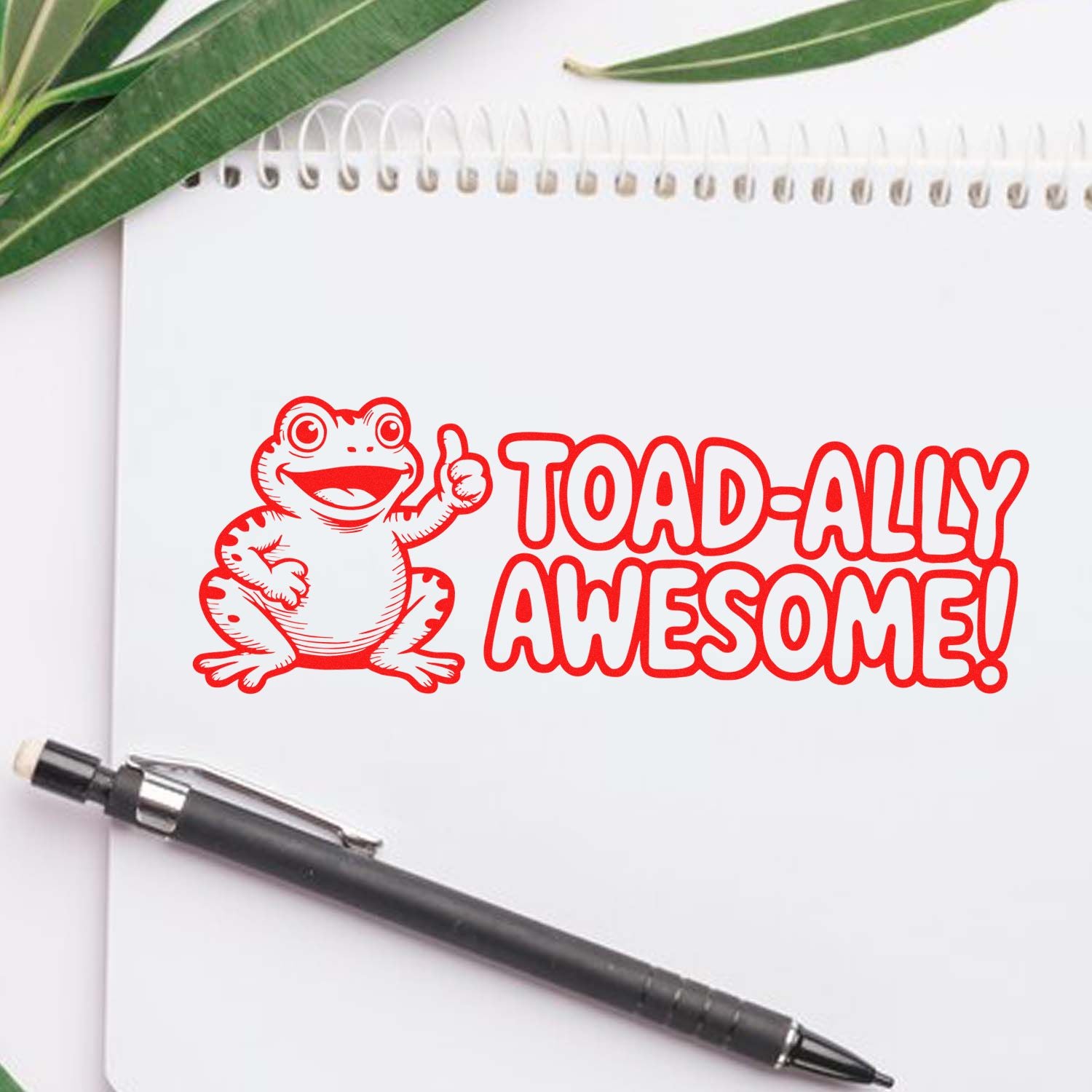 Funny frog rubber stamp reading Toad-ally Awesome on notebook, perfect for fun teacher and craft projects.