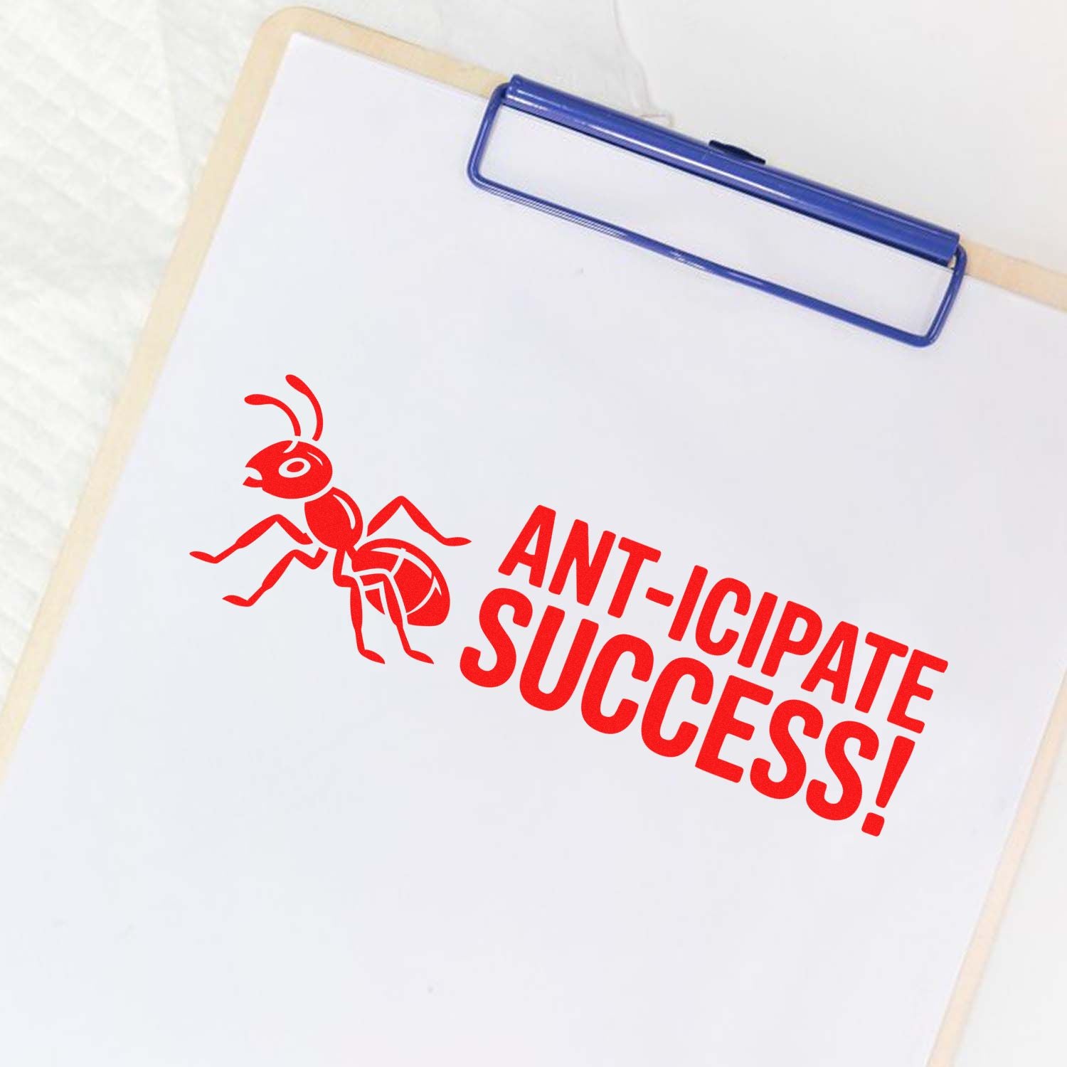 Custom rubber stamp design reading Ant-icipate Success! with ant graphic, ideal for office branding or motivational stamping.