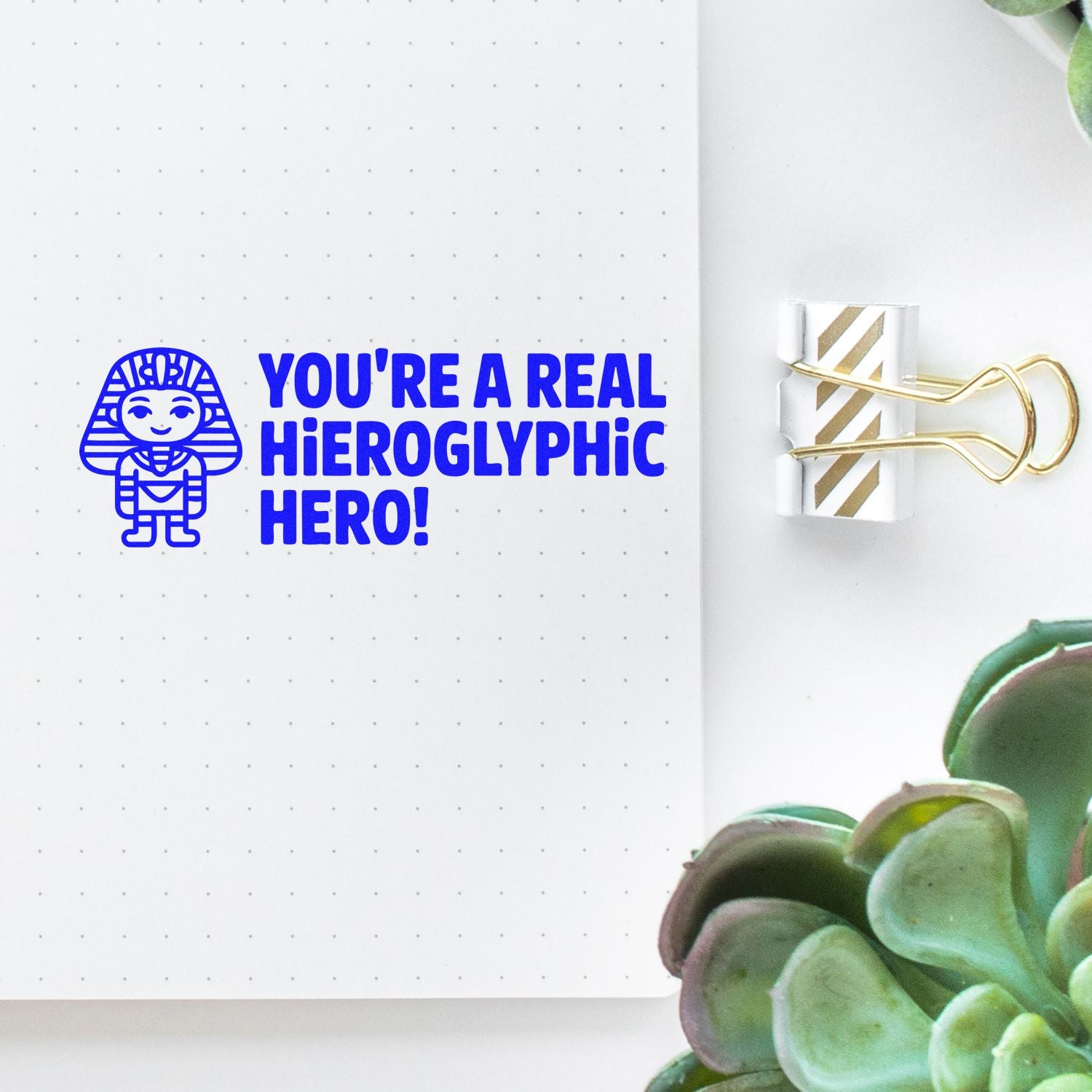 Funny rubber stamp design with pharaoh illustration and Youre a real hieroglyphic hero! pun for notebooks and crafts.