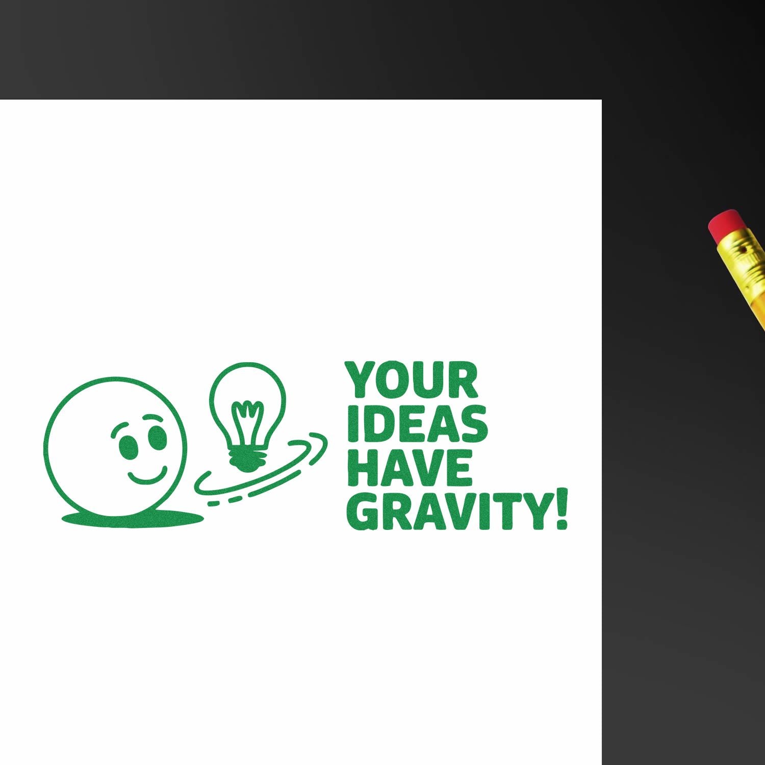 Custom rubber stamp impression with Your Ideas Have Gravity! quote and lightbulb icon for creative branding.