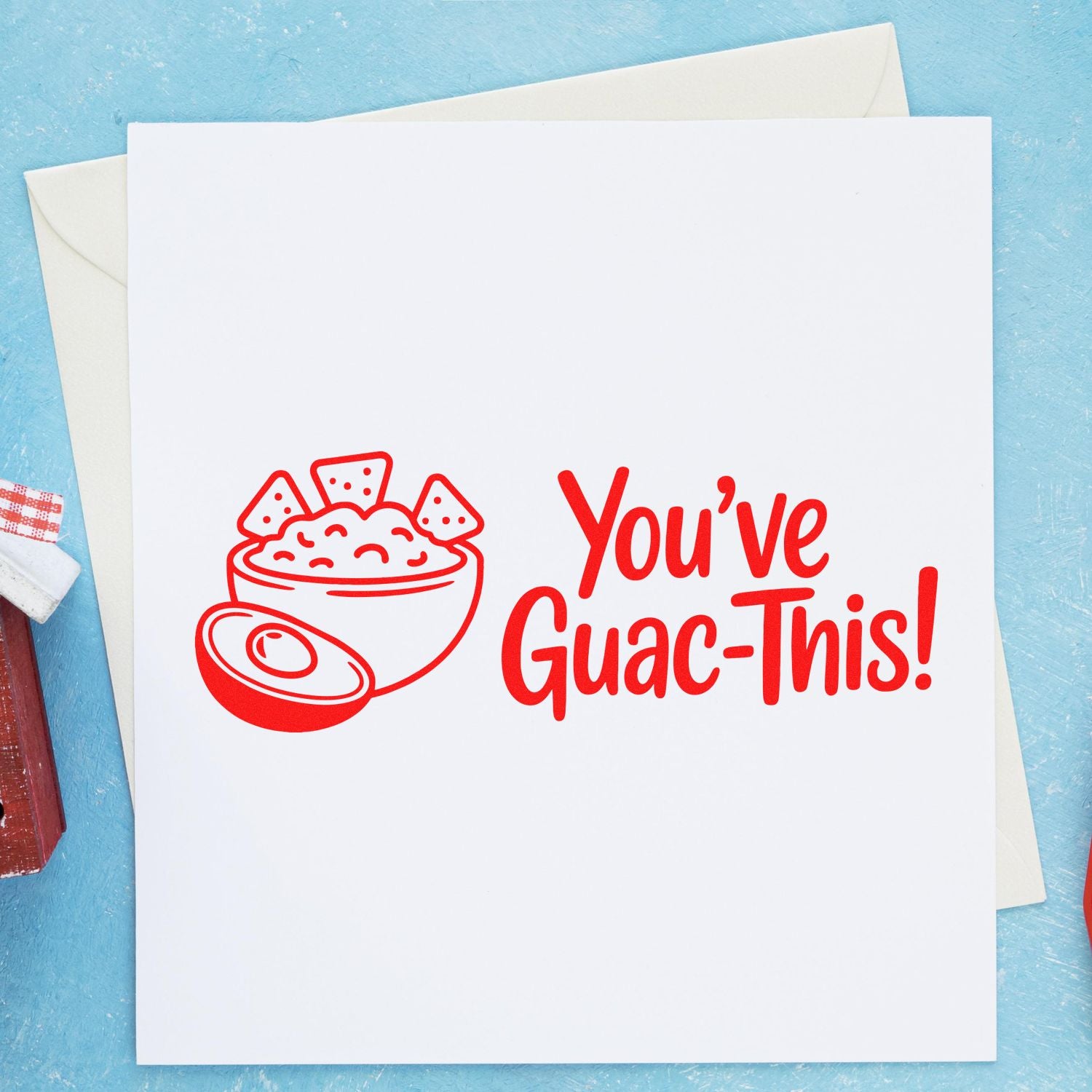 Custom rubber stamp reading Youve Guac-This! with a guacamole bowl, shown on a blank greeting card.