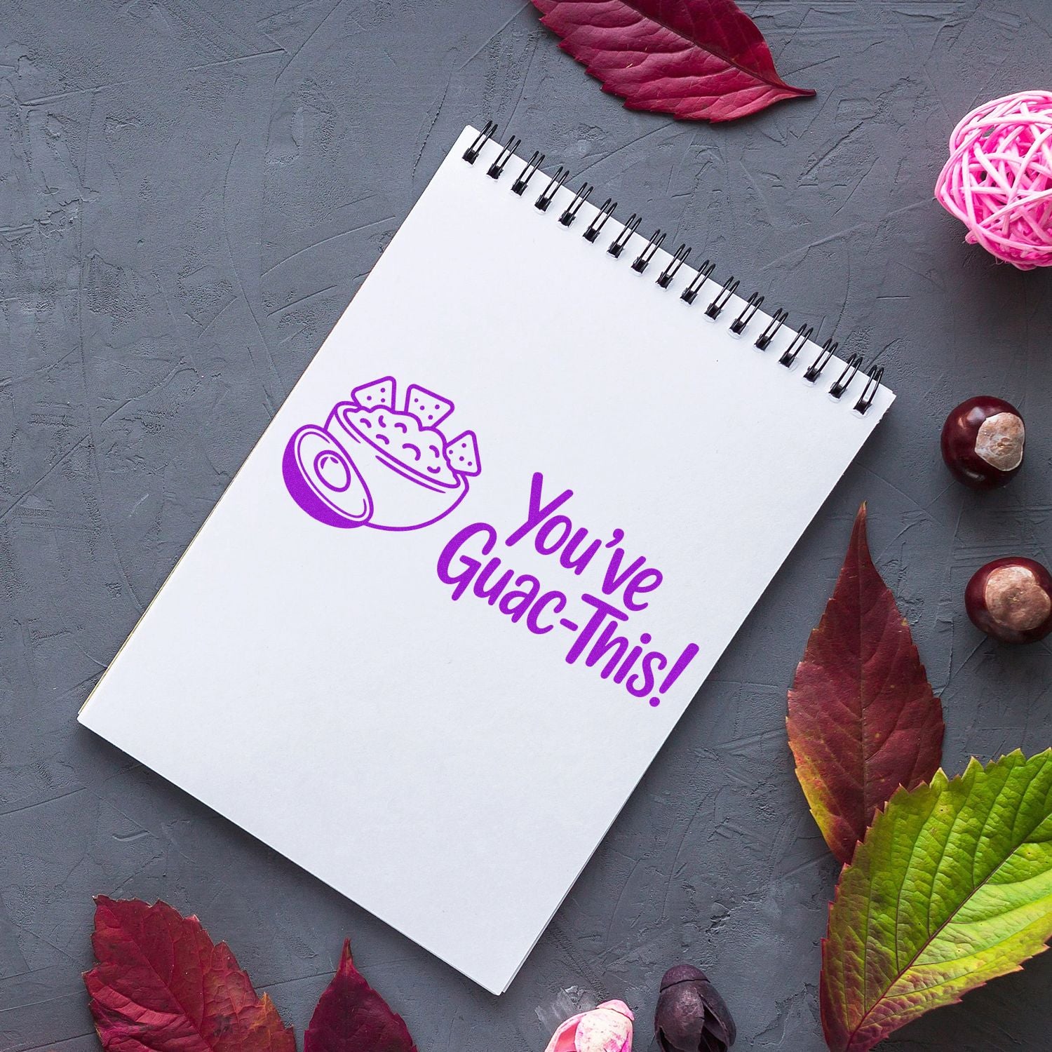 Avocado-themed Youve Guac-This! rubber stamp design on a spiral notebook for motivational stationery branding.
