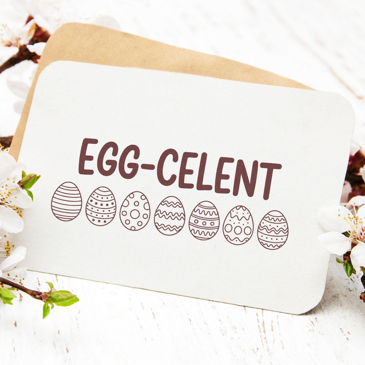 Easter rubber stamp reading Egg-celent with decorative eggs, perfect for spring cards, crafts, and holiday packaging.